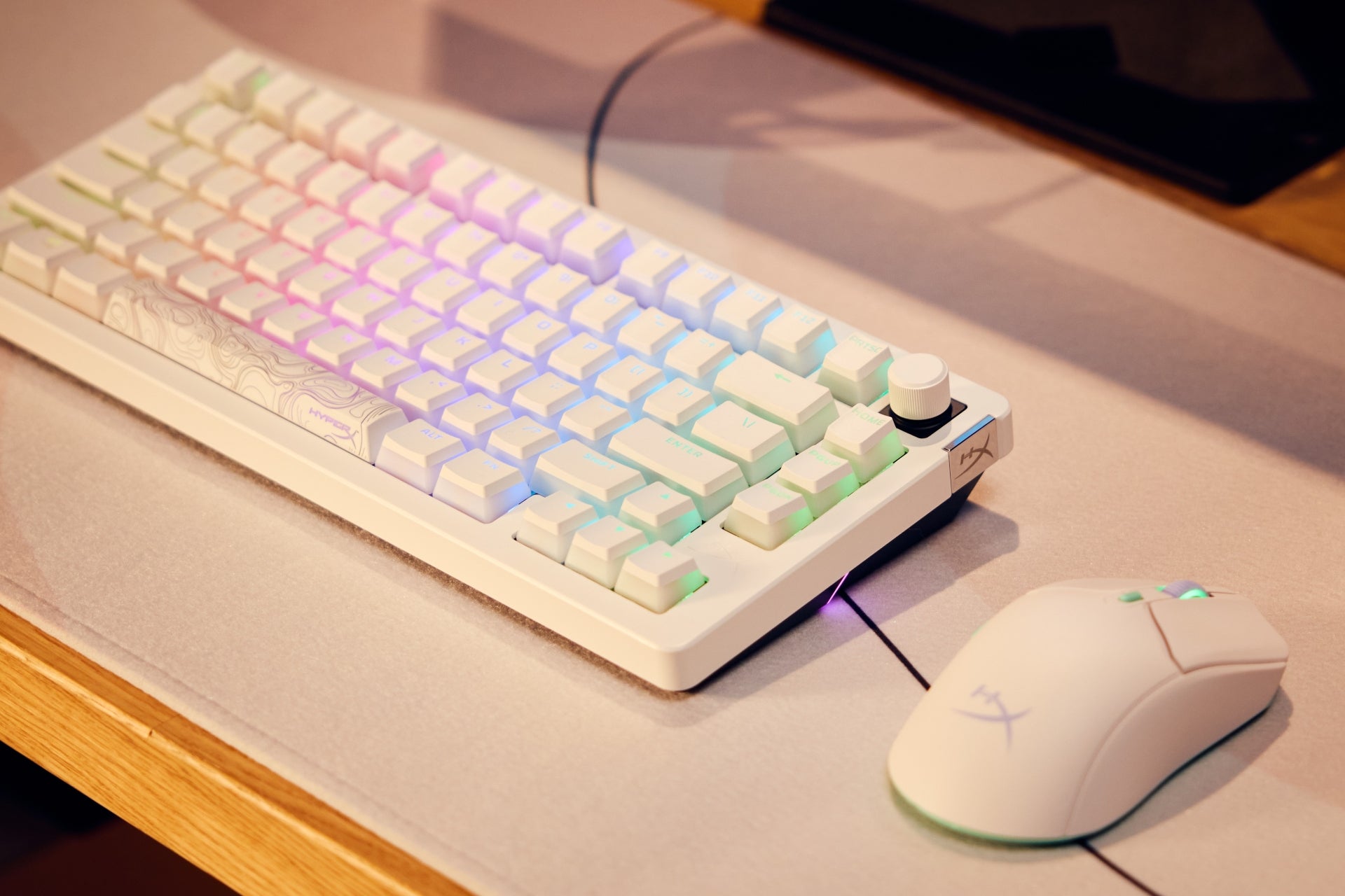 White gaming Keyboard and mouse set with RGB lighting on a desk